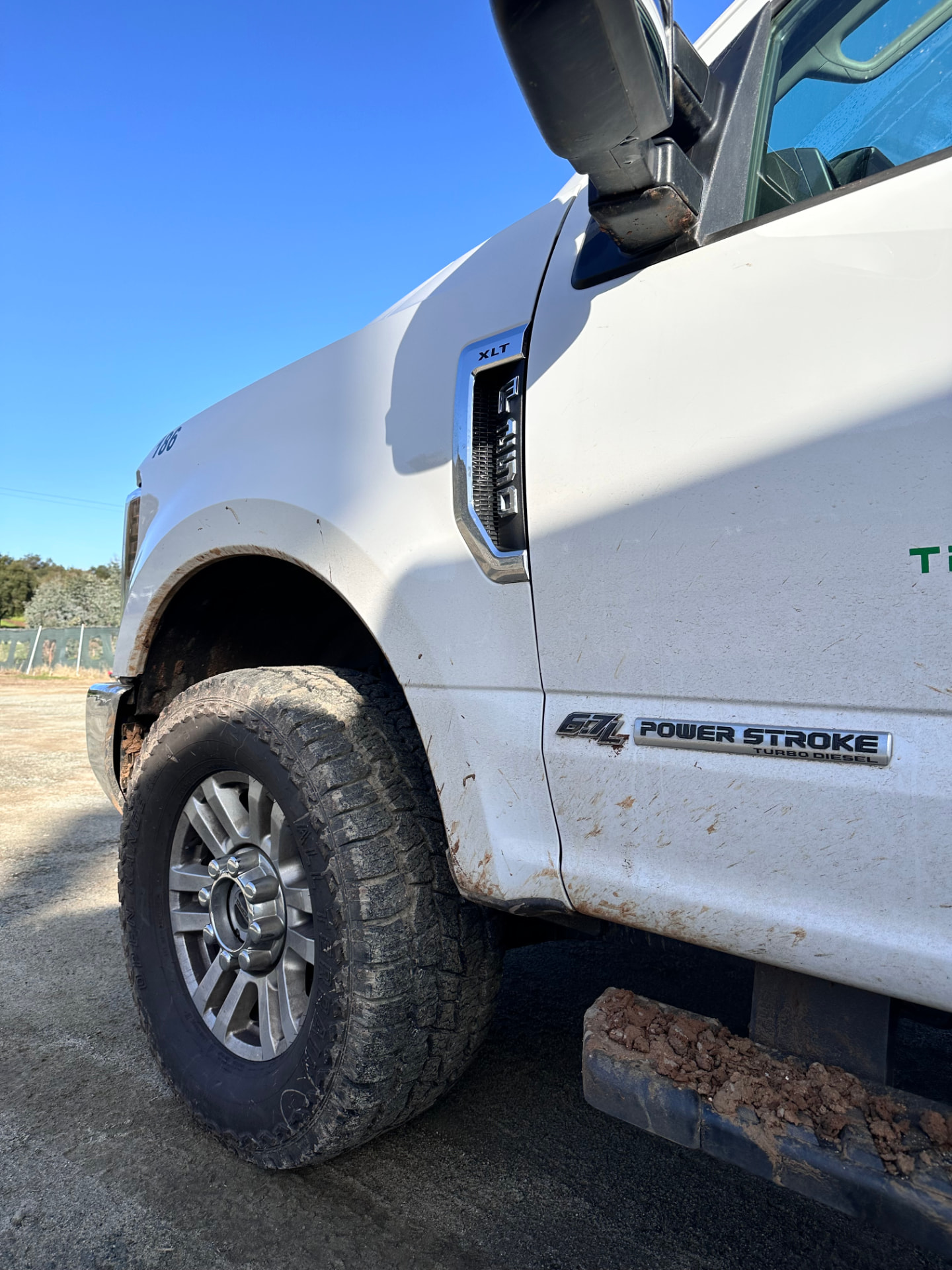 White Ford Super Duty truck before detailing