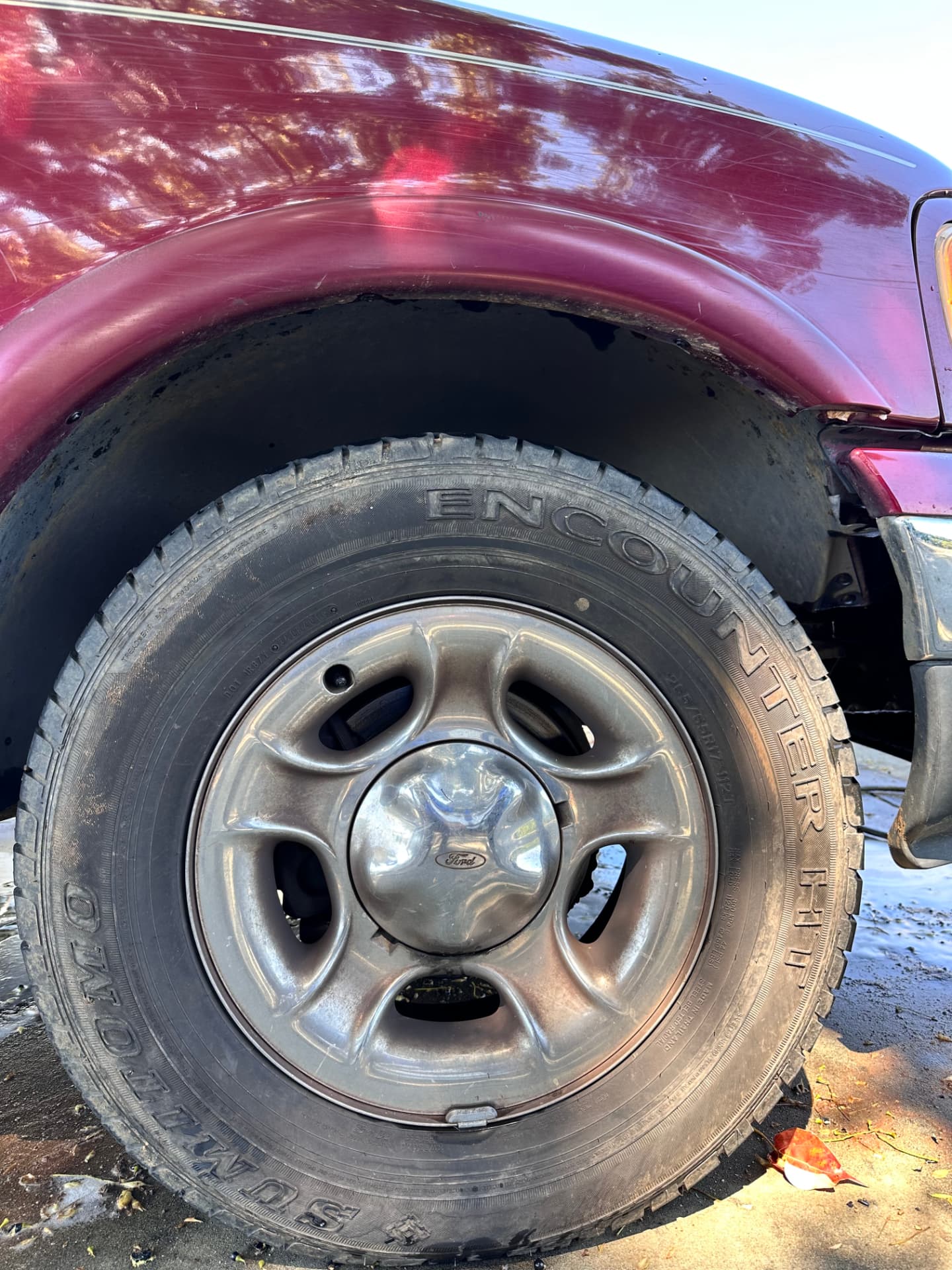 Ford truck wheel and paint before detailing